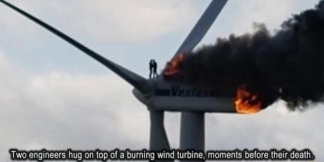 Two Engineers Hug On Top Of A Burning Wind Turbine Moments Before