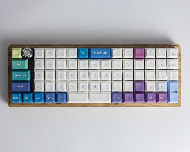 Custom 60 Ortho layout with numpad (albeit with a weird af backspace