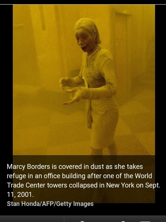 Marcy Borders is covered in dust as she takes refuge in an office building after one of the