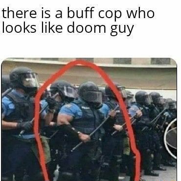 There is a buff cop who looks like doom guy - iFunny