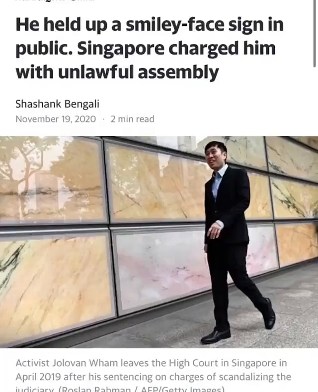 He Held Up A Smiley Face Sign In Public Singapore Charged Him With