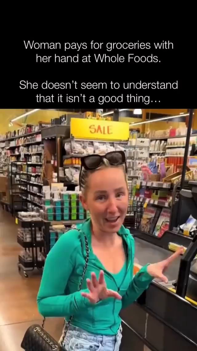 Woman pays for groceries with her hand at Whole Foods. She doesn't seem ...